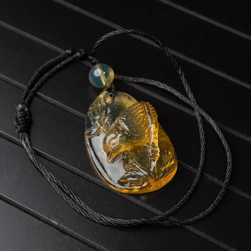 Dominican Blue Amber Pendant, Bird Carved