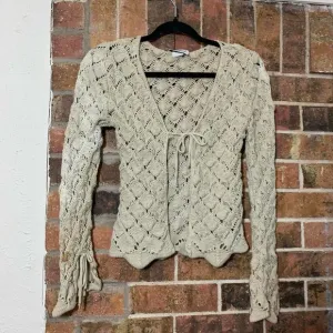 Vintage 90’s Cream crochet cardigan with ruffle sleeves and tie front